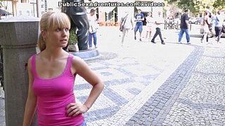 Sexy girl shows tits in the middle of a lively square - porn video